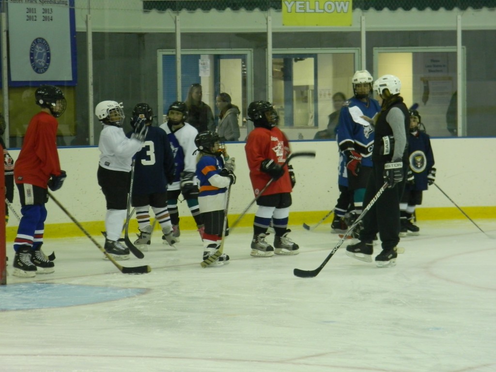 Hockey players getting instructions