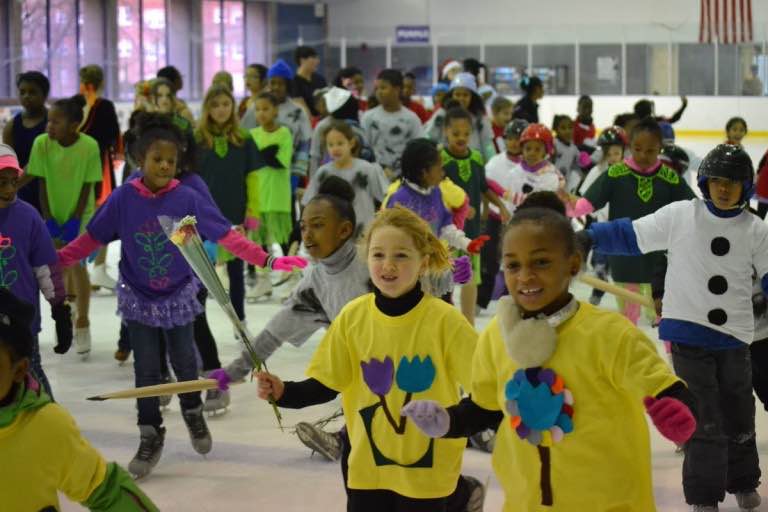 Kids skating and taking lessons